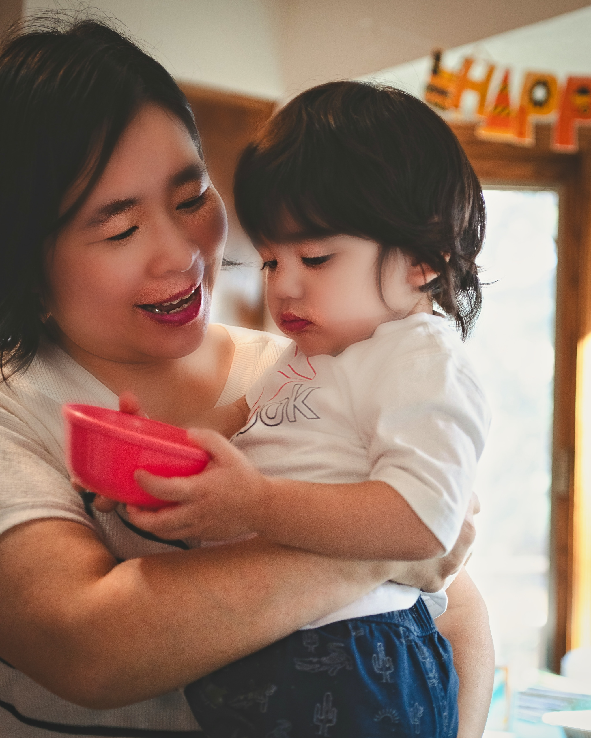 Mother laughing with her toddler at home — Twin Cities family photography by Loon & Birch Photography