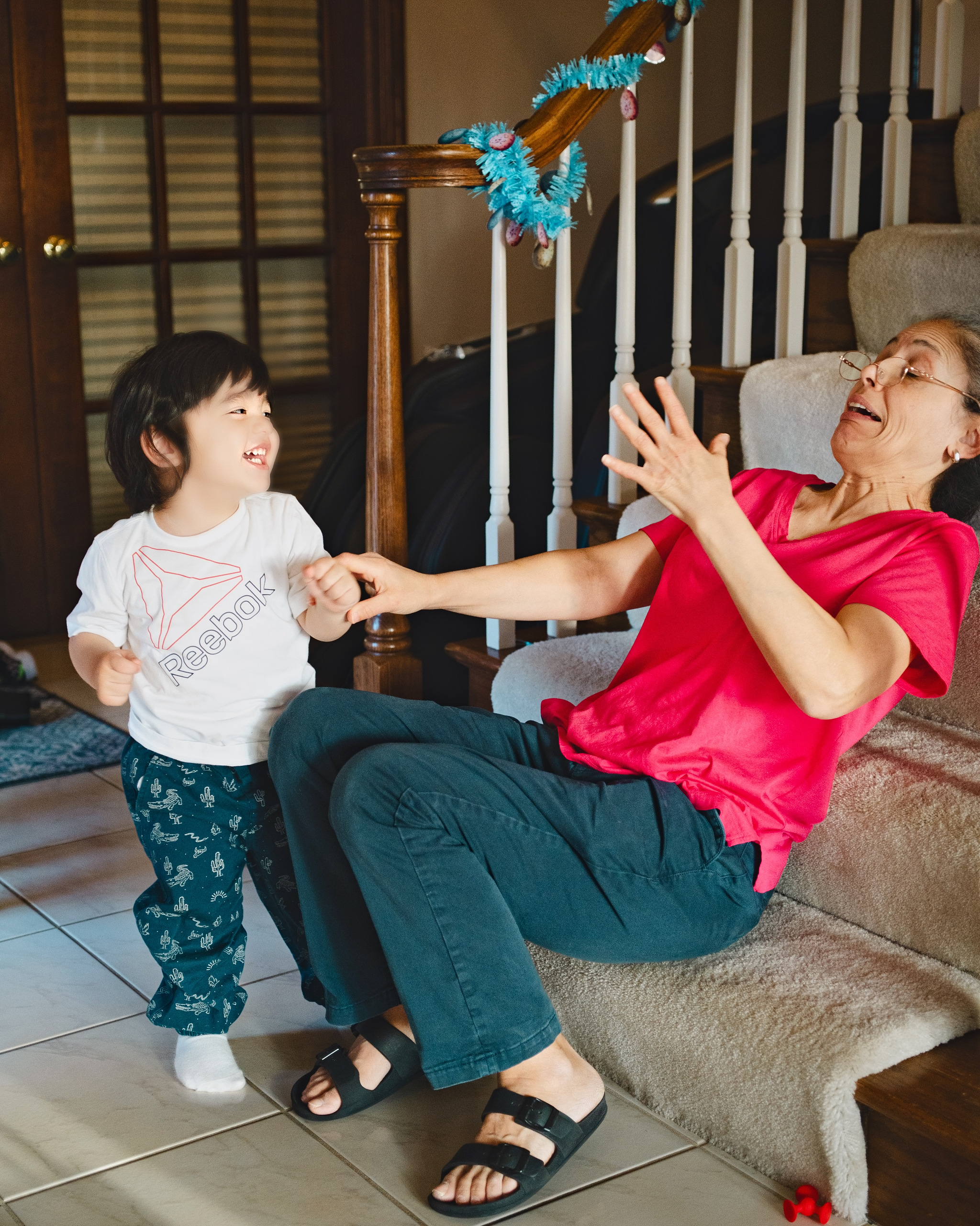 Grandmother and toddler playing together at home — Twin Cities family photography by Loon & Birch Photography