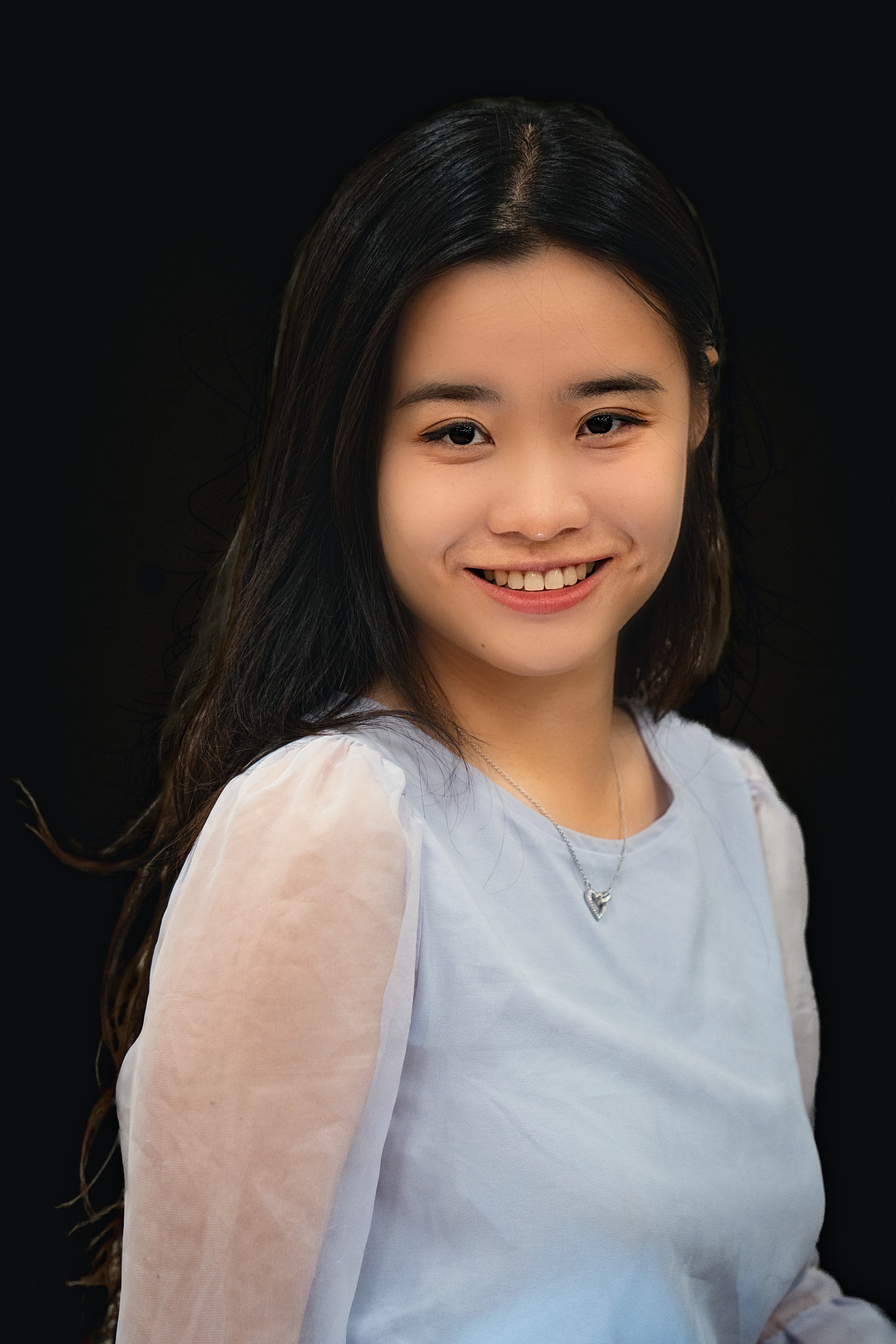 Professional headshot of a young woman on a black background — Minneapolis commercial photography by Loon & Birch Photography